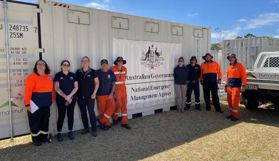 NEMS staff in front of pallet 