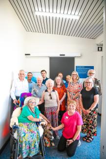 A photo of members of the Yarra Ranges Disability Advisory Committee gathered together outside an accessible toilet.
