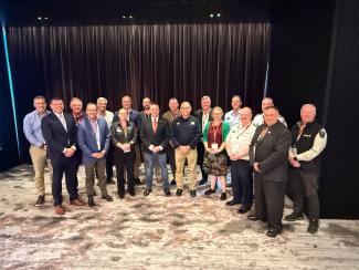 Commissioners and Chief Officers Strategic Committee standing in room