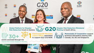 Photo of the Minister flanked by 2 men, in front of a media wall with G20 South Africa logos. They are posing and holding a document (we can't see the title) and smiling off camera. Overlaid on the photo is an infographic with the statistics mentioned under the heading 'Strategic recovery and international engagement'.